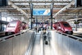 Two Thalys high-speed trains stationing at the same platform in Brussels-South railway station Royalty Free Stock Photo