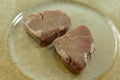 Two thawed frozen raw top sirloin steak fillets Royalty Free Stock Photo