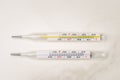 Two thermometers on white background