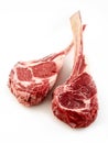 Two thick bone-in tomahawk or ribeye steaks Royalty Free Stock Photo