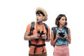 Two thoughtful young tourists with digital camera and binoculars looking away Royalty Free Stock Photo
