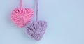 Two thread hearts hang on a white background. Holiday card, background. The concept of Valentine's Day, March 8, Mother Royalty Free Stock Photo