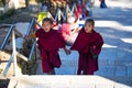 Two Tibetan Buddhist novice monks hand in hand , Nepal