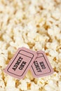 Two tickets on popcorn background