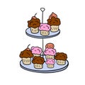 Two-tier serving tray with cupcakes. Plate with sweet dessert.