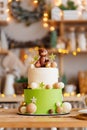 two-tiered white-green cake with balls, stars and teddy bear for birthday. Royalty Free Stock Photo