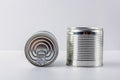 Two tin can canned food on white background. Food supplies during coronavirus quarantine and self-isolation. Food delivery,