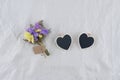 Two tiny heart black board with statice flowers