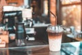 Two tone Iced coffee in coffee shop. Brown and white Ice coffee or caffe latte with milk in takeaway cup. copy space for text. Royalty Free Stock Photo