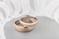 Two-tone wedding rings with ribbon Royalty Free Stock Photo