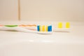 Two toothbrushes on the washsink, the bathroom Royalty Free Stock Photo