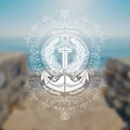 Two Torch Cross And Anchor in Centre. Marine Vintage Label On Blurred Photo Background Royalty Free Stock Photo