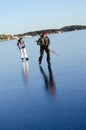 Two tour skaters on smoth ice