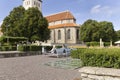 Two tourist relaxing on benches near to Nicholas Church on sunny day