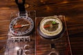 Two magnetic compasses on wooden table Royalty Free Stock Photo