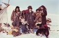 Two tourists (caucasian man and woman) visiting remote station of the indigenous people