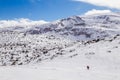 Two tourists hiking in the winter mountain Rila, Bulgaria.