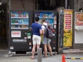 Two tourists at Japanese vending machine