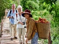 Two tourists with Vietnamese woman in countryside Royalty Free Stock Photo