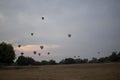 Two tourists watches the hot air balloons in the sky, Bagan, Nyaung-U, Myanmar