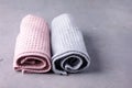 Two Towels Tolled Up on a Gray Background Pink and Gray Towels Horizontal Royalty Free Stock Photo