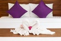 Two Towels on White Bed Sheet Royalty Free Stock Photo