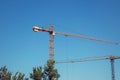 Two tower cranes at a construction site Royalty Free Stock Photo