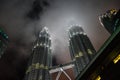 Two towers poking through the hazy night sky