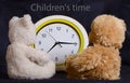 Two toy bears look at the watch