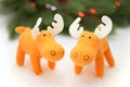 Two toy elks in artificial snow