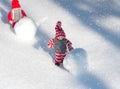 Two toy little men playing in the snow, snowfall Royalty Free Stock Photo