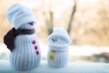 Two toy snowmen on blurry background Royalty Free Stock Photo