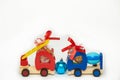 Two Toy Wooden Trucks With Gift Chocolate And Rainbow Candies On The White Background. Childhood