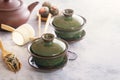 Two traditional Chinese porcelain green tea cups stand on a gray table. Royalty Free Stock Photo