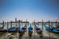 Grand Canal gondolas at pier, island of San Giorgio Maggiore in the background Royalty Free Stock Photo