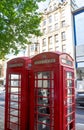 Two traditional old red telephon booth in the central London Royalty Free Stock Photo