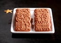 Two traditional spicy Dutch speculoos biscuits