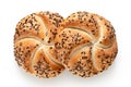 Two traditional white kaiser rolls with linseeds and sesame seeds isolated on white. Top view Royalty Free Stock Photo