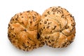 Two traditional whole wheat kaiser rolls with linseeds and sesame seeds isolated on white. Top view Royalty Free Stock Photo