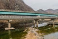 Two traffic bridges crossing small river