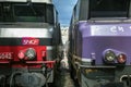 Two trains ready for departure in Paris Gare de l`Est train station, with the logo of SNCF seen in front Royalty Free Stock Photo