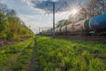 two trains with tank wagons move on railway