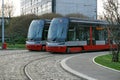 Two trams on the parallel cobbled tracks in Prague, Czech republic Royalty Free Stock Photo