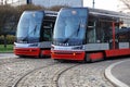 Two trams on the parallel cobbled tracks in Prague, Czech republic Royalty Free Stock Photo