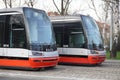 Two trams on the parallel cobbled tracks in Prague, Czech republic Royalty Free Stock Photo