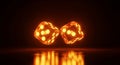Two glowing orange dice with visible pips reflecting on a dark glossy surface gambling game Royalty Free Stock Photo
