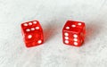 Two translucent red craps dices on white board showing Centerfield Nine / Nina number 6 and 3