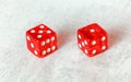 Two translucent red craps dices on white board showing Easy Six / Jimmie Hicks number 5 and 1