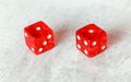 Two translucent red craps dices on white board showing Snake Eyes Double number 1