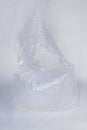 Two transparent inflated plastic crumpled empty cellophane bags on white back